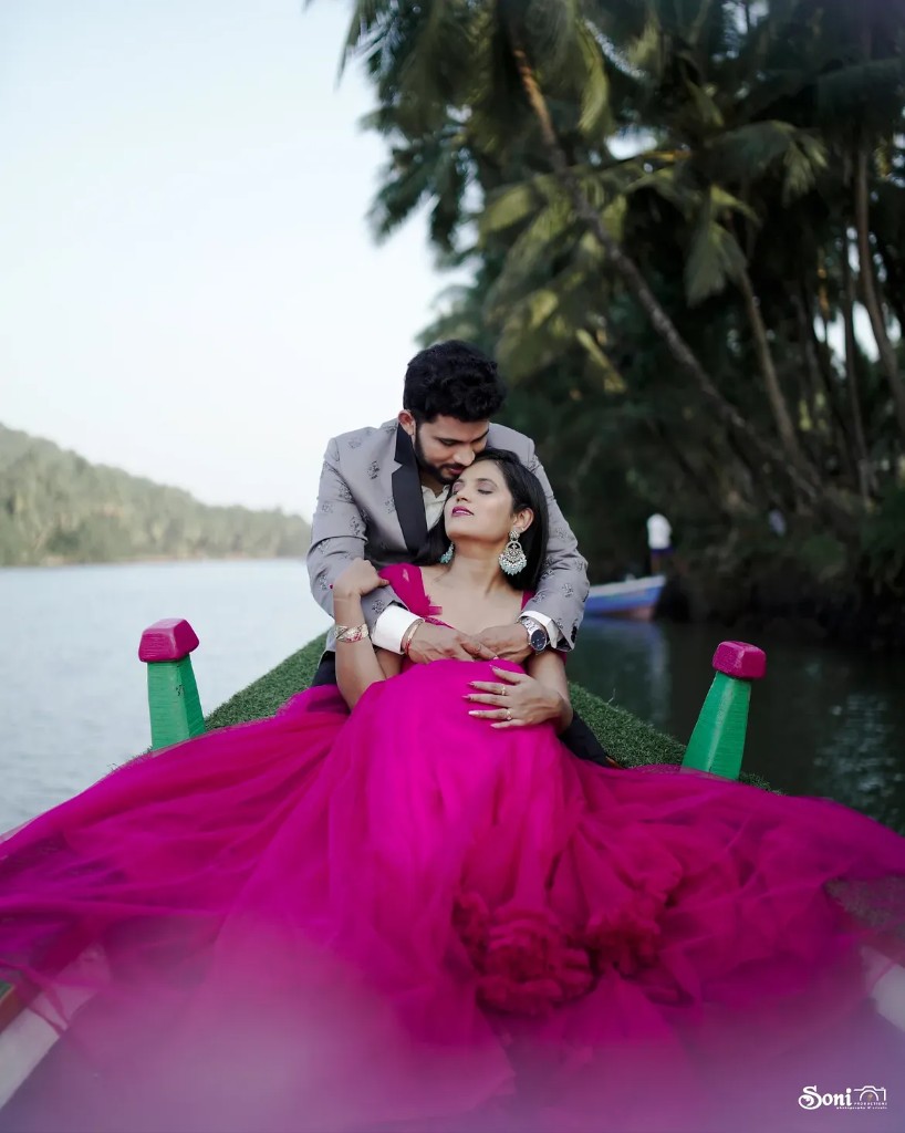Pre-wedding on a boat — couple in a magenta gown