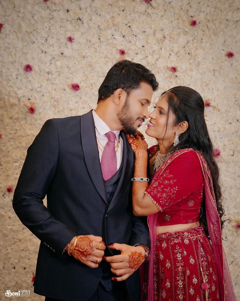 Wedding couple portrait against a floral backdrop