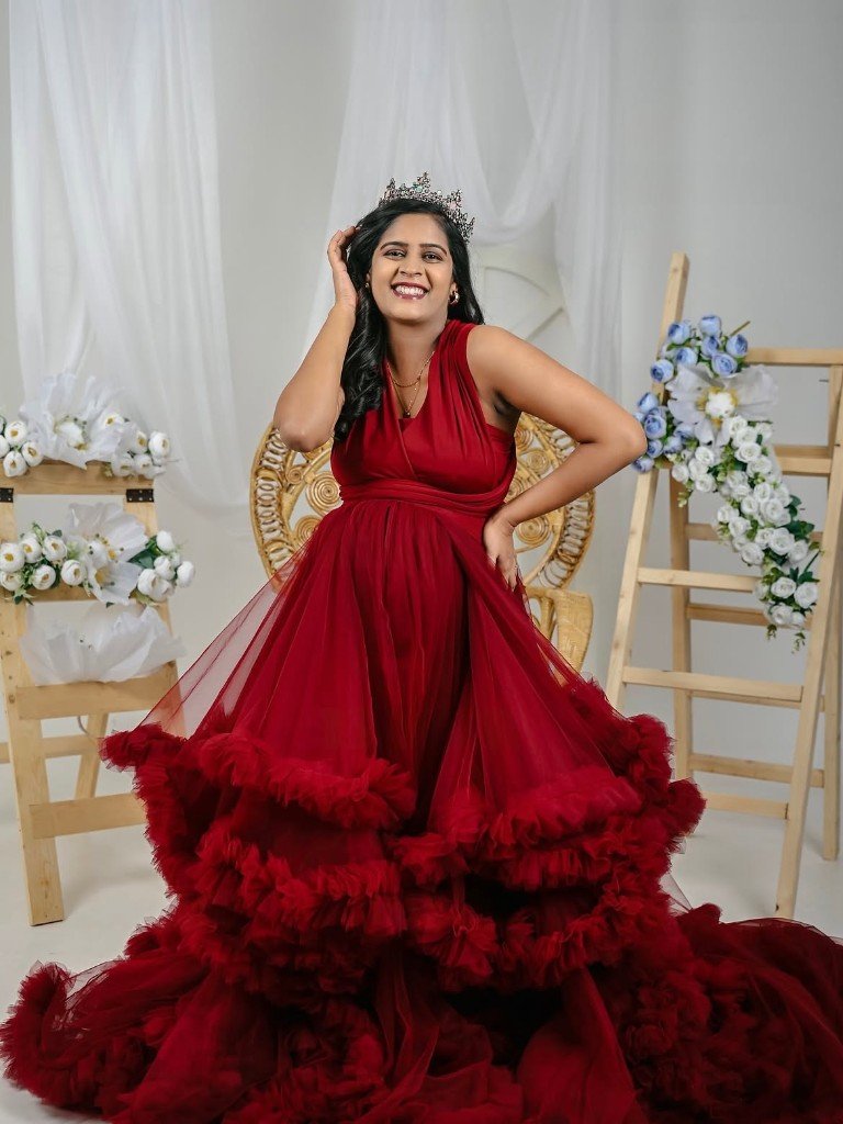 Maternity portrait in a dramatic red gown