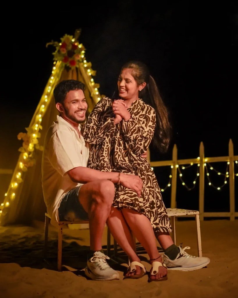 Candid couple laughing together at night