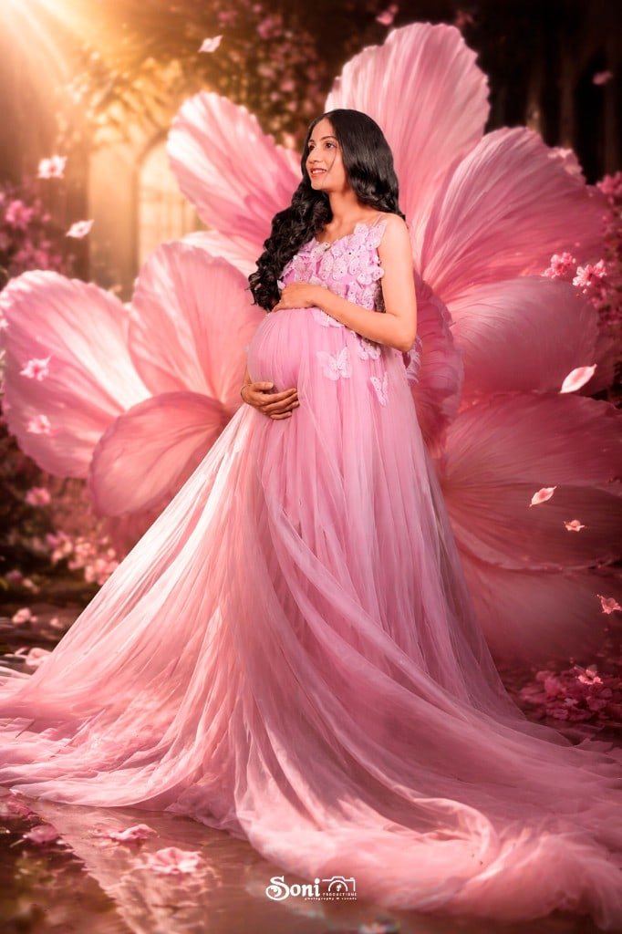 Fantasy maternity portrait in a pink gown