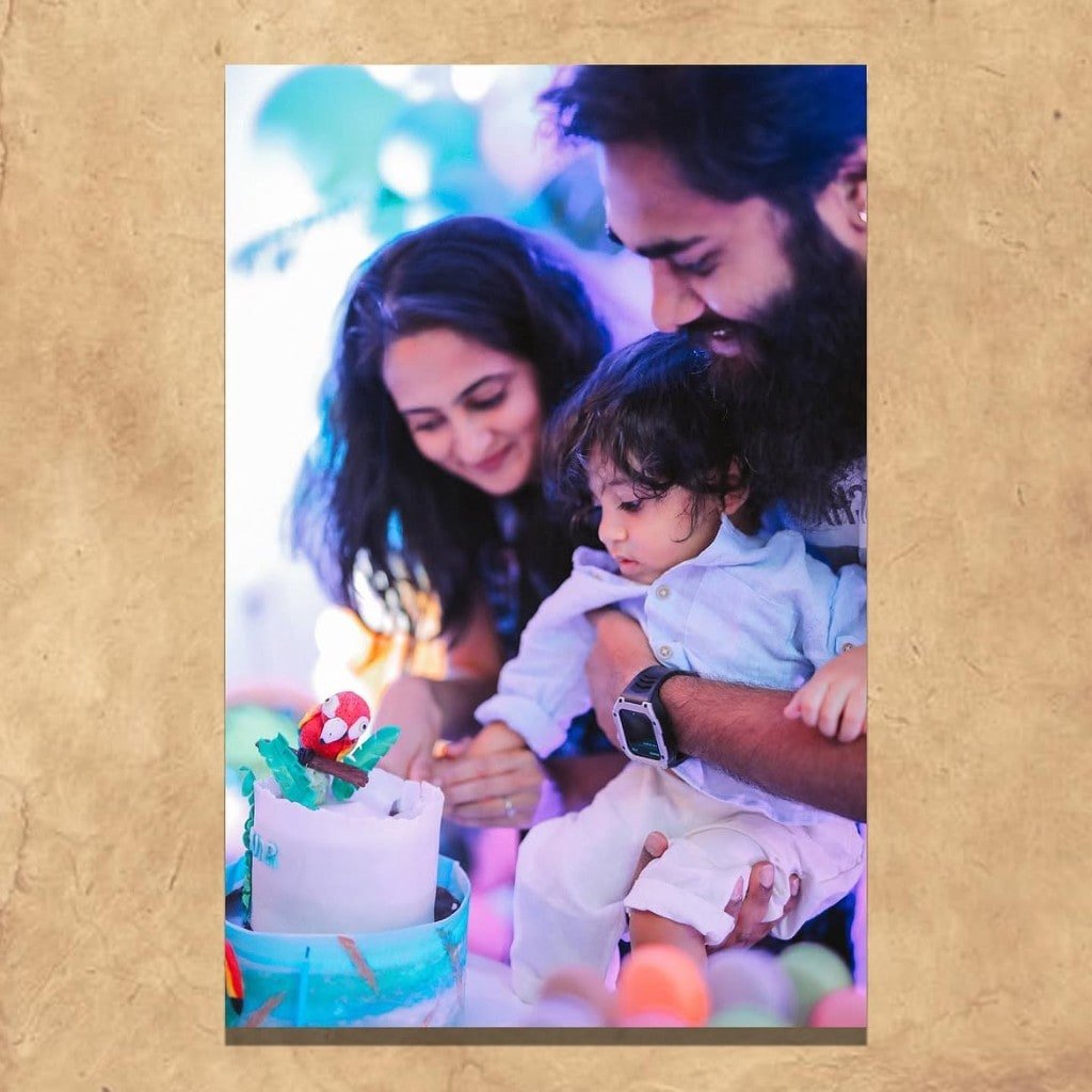 Family gathered around a birthday cake