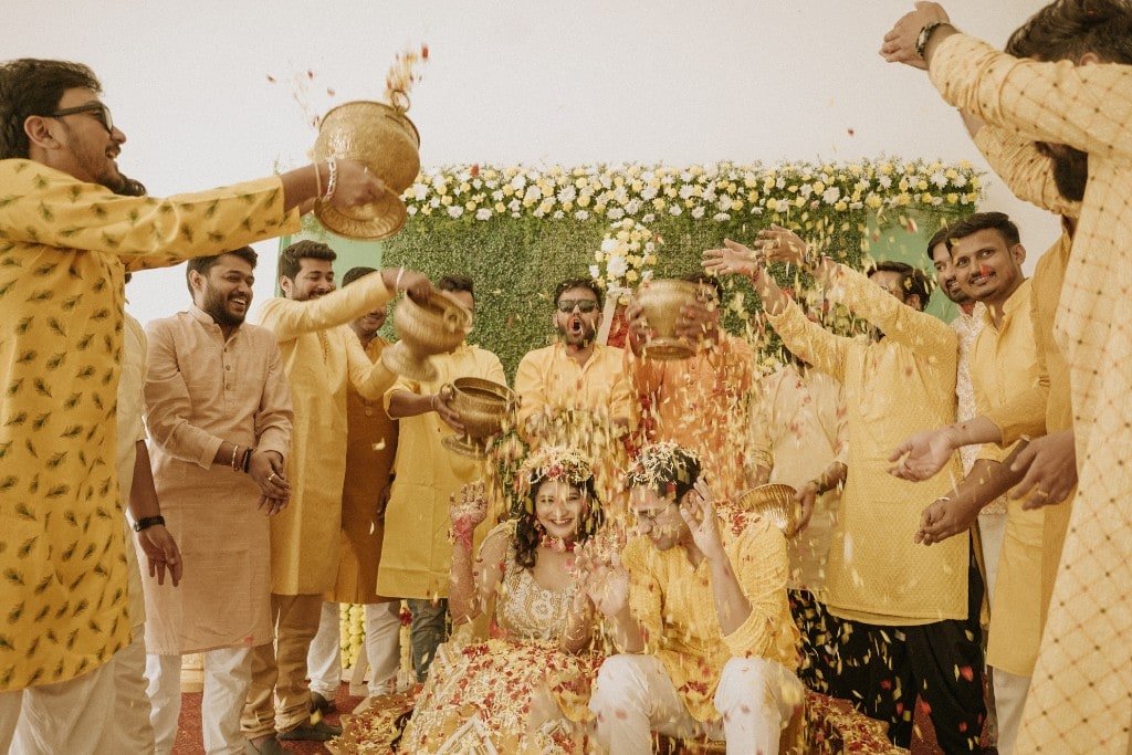 Haldi ceremony with yellow and orange petals