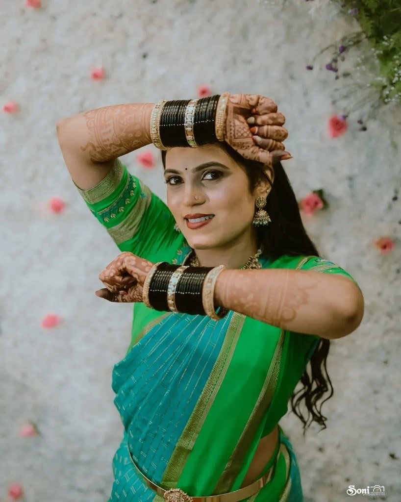 Bridal portrait in a green and teal saree