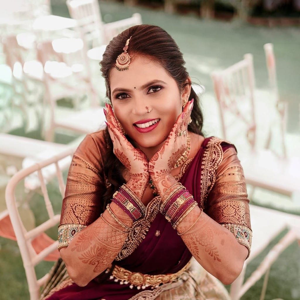 Bridal mehendi with hands framing the face