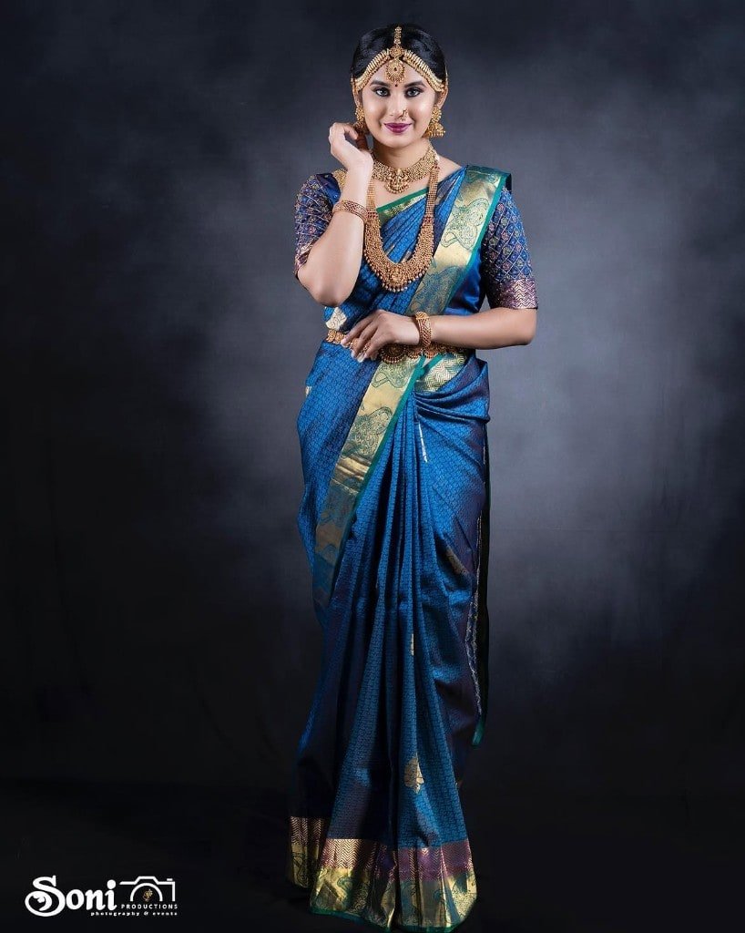 Bridal makeup in a royal blue silk saree