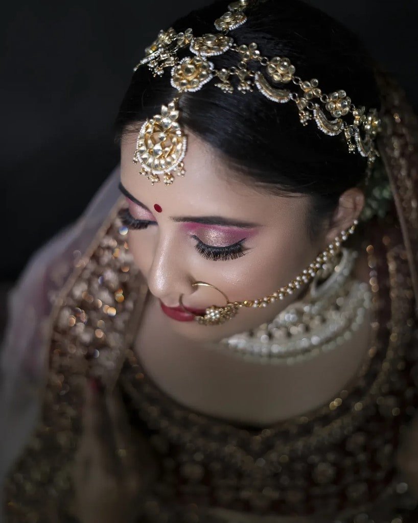 Bridal makeup close-up with traditional gold jewellery