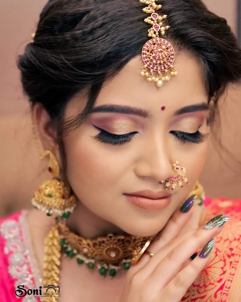 Bridal makeup close-up with gold and pink jewellery