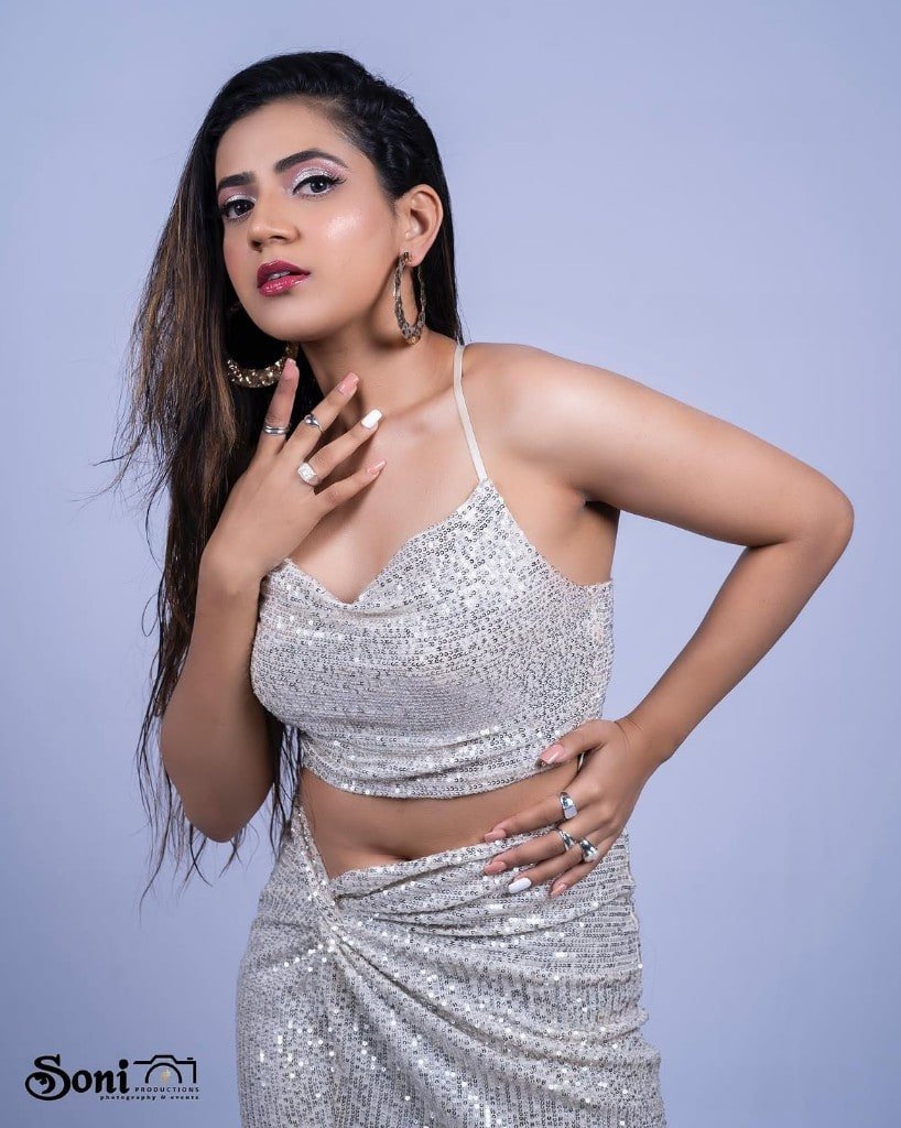 Glam studio makeup in a silver sequin outfit