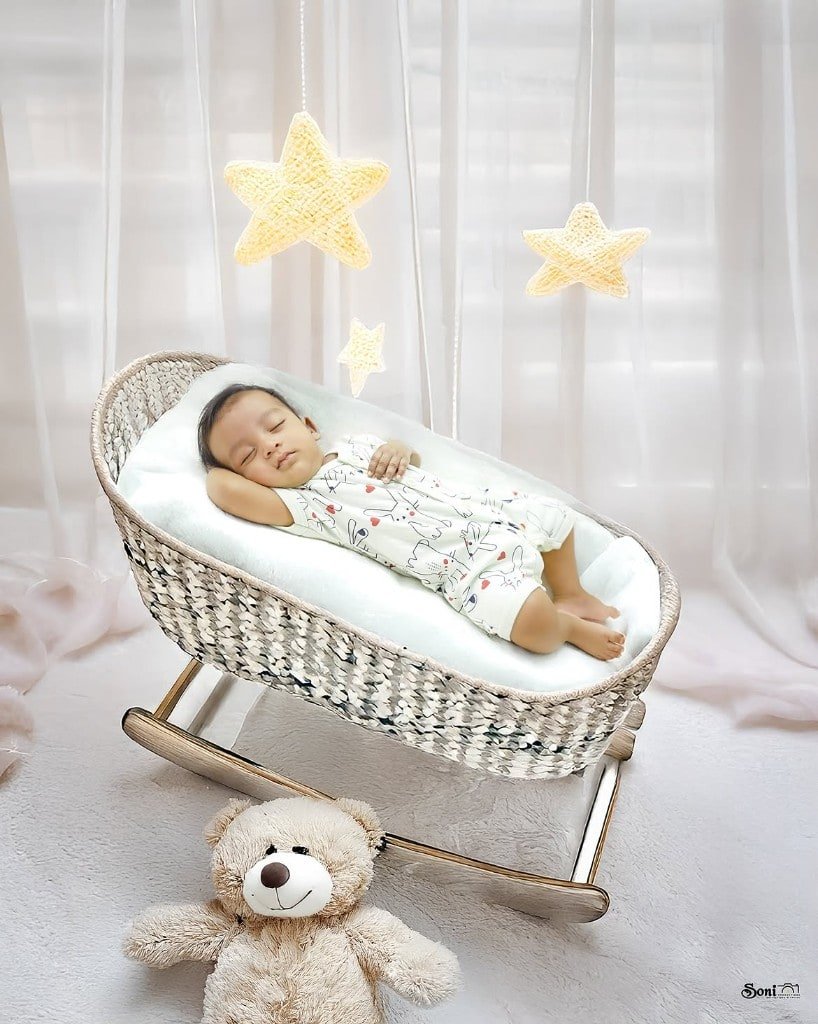 Baby sleeping in a studio bassinet