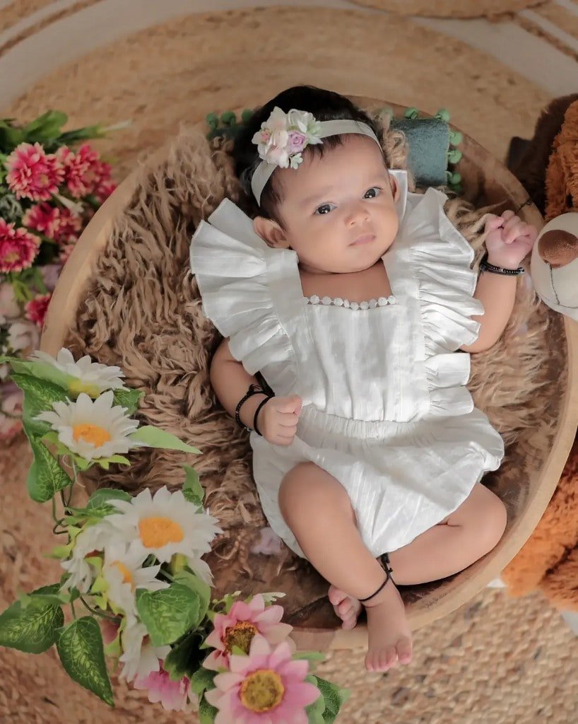 Baby portrait in a wooden bowl