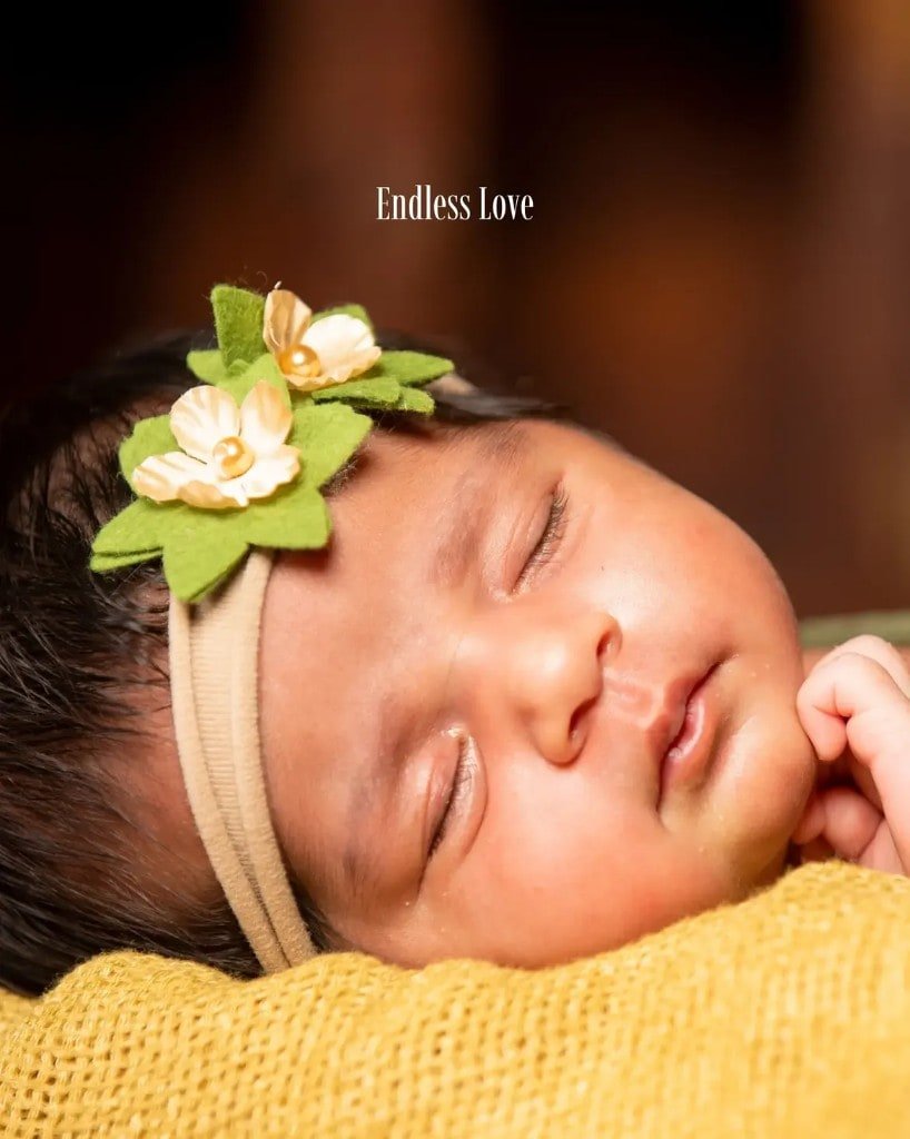 Sleeping newborn with floral headband