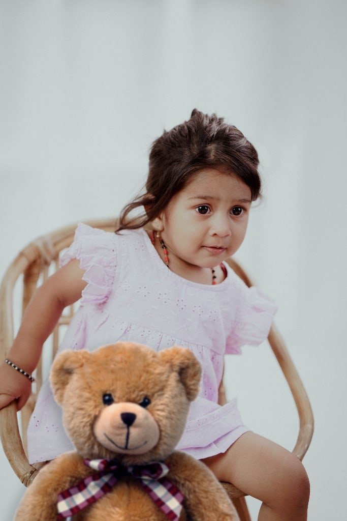 Toddler portrait in a wicker chair