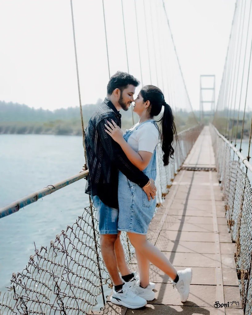 Couple on a suspension bridge