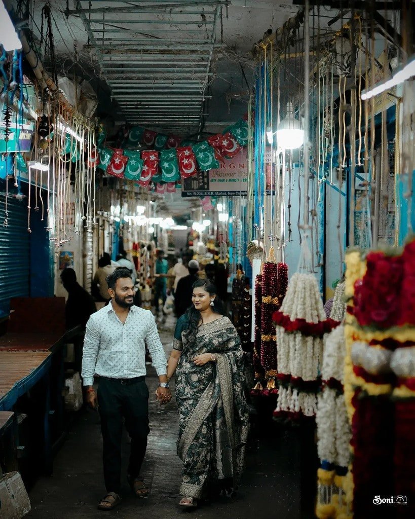 Couple walking through a flower market
