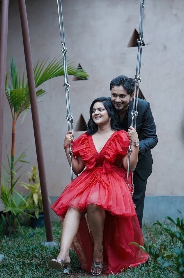 Engagement portrait on a garden swing