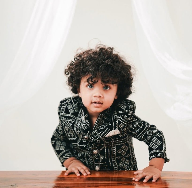 Toddler portrait in a patterned formal jacket