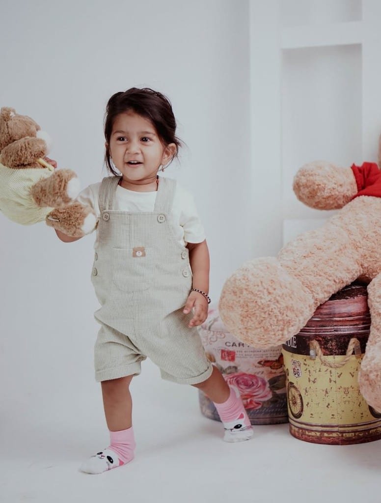 Toddler studio portrait with teddy bears