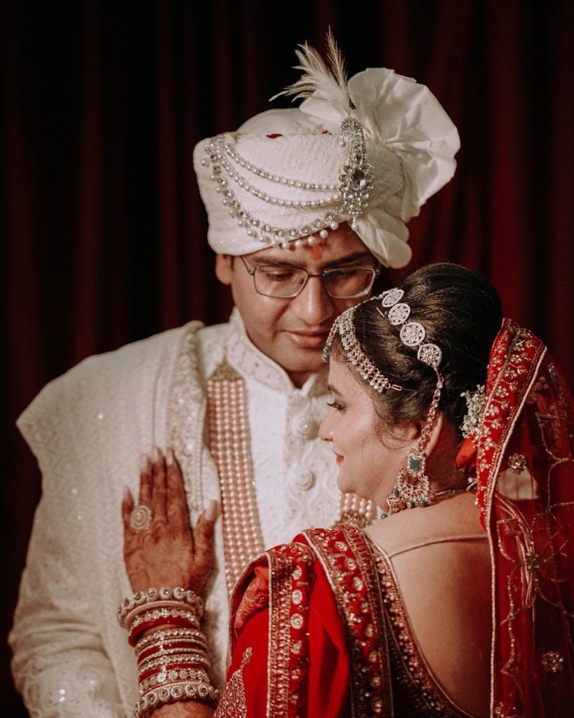 Intimate wedding portrait in red and white