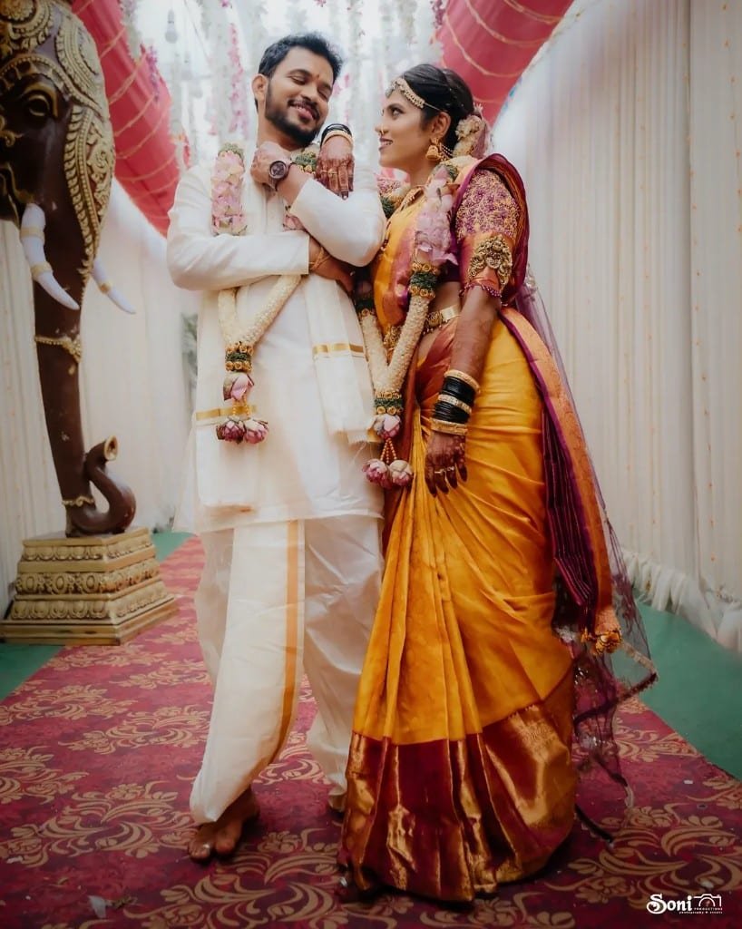 Wedding couple in yellow saree and white veshti