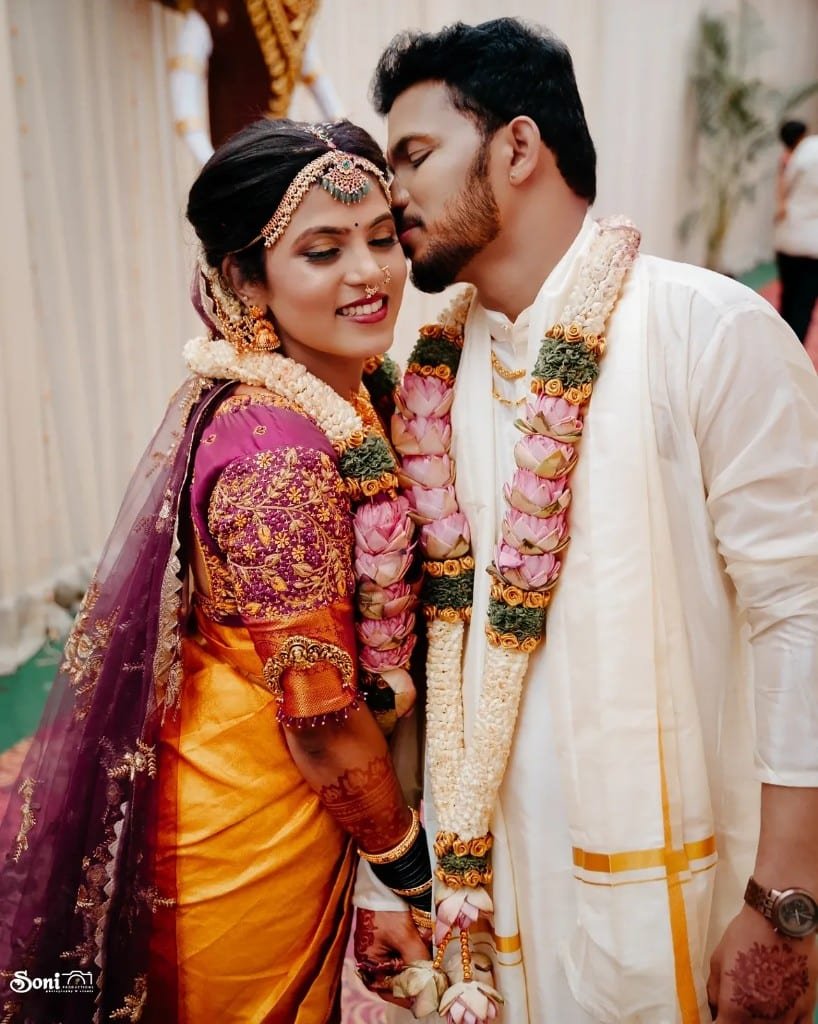 Tender wedding portrait — forehead kiss